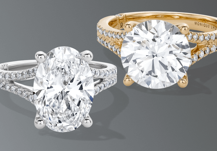 Two engagement rings in warm and cool tones.