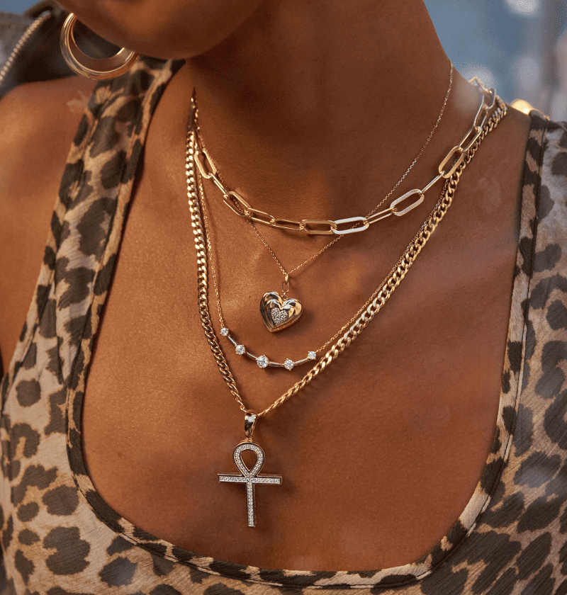Woman wearing a variety of beautiful necklaces.