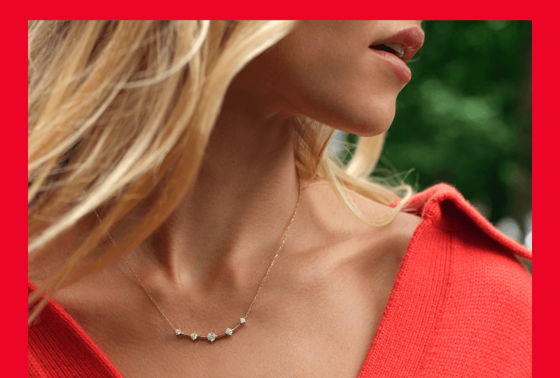 Woman showcasing beautiful necklace.