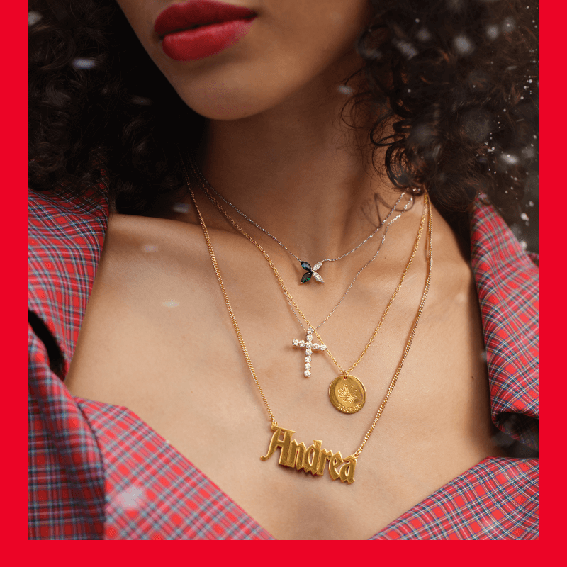Woman showcasing multiple necklaces.