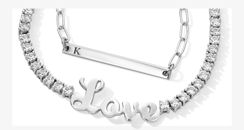 Showcase of personalized necklaces with name engravings.