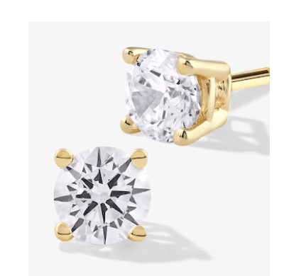 Round diamond stud earrings in yellow gold.