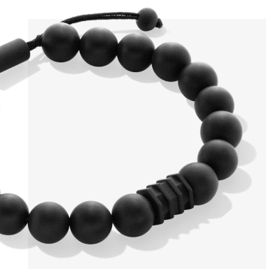 Black matte beaded bracelet with adjustable cord closure.