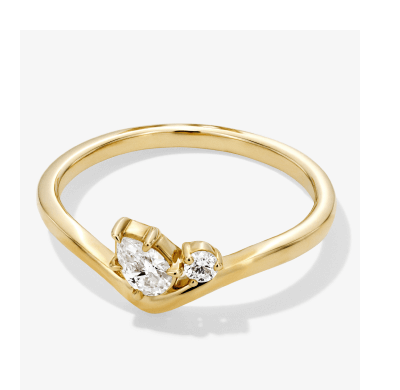 Yellow gold bypass ring with two round diamonds in prong settings.