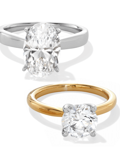 Oval-cut solitaire ring in white gold and round solitaire ring in yellow gold.