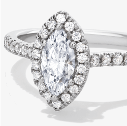 White gold engagement ring with a marquise-cut diamond center surrounded by a pavé diamond halo.