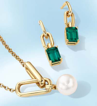 Yellow gold and emerald drop earrings, and yellow gold and pearl pendant necklace.