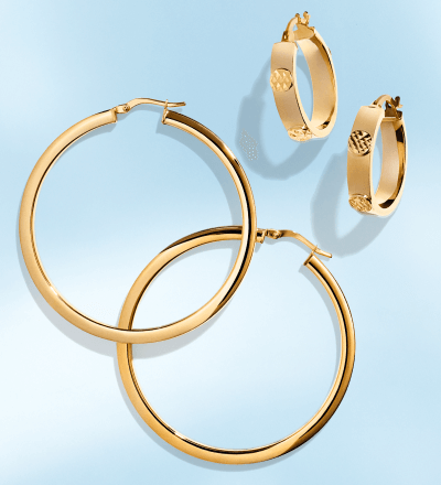One set of small and one set of large yellow gold hoop earrings.