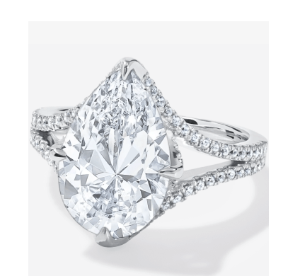 White Gold Pear Shaped Diamond Engagement Ring With Milgrain Detail Along The Bridge.