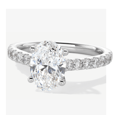 White Gold Oval Cut Diamond Engagement Ring With Pavé Band.
