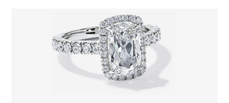 White Gold cushion Cut Diamond Engagement Ring with Halo and Pavé Band.