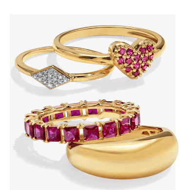 Variety of yellow gold gemstone, diamond, and puffy rings.