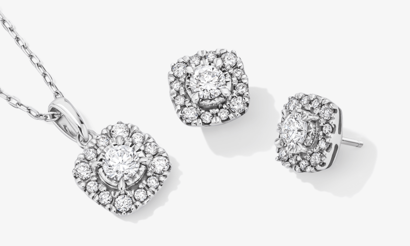Round Diamond Halo Pendant Necklace and Matching Stud Earrings in White Gold.