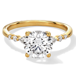 Round-Cut Diamond Engagement Ring with Round Accent Diamonds on a Yellow Gold Band.