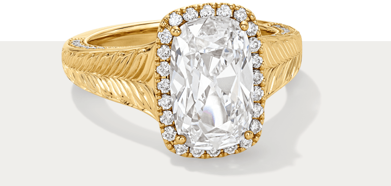 Yellow gold cushion cut engagement ring.