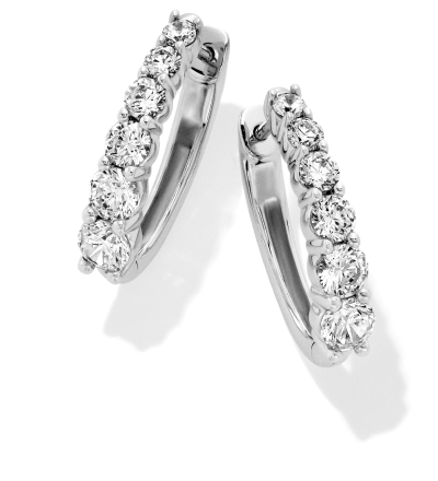 A pair of white gold and diamond hoop earrings. 