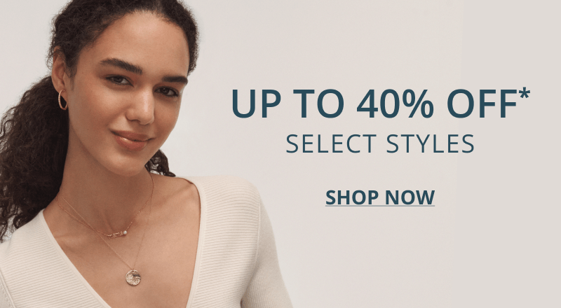 Woman wearing ivory sweater and variety of fine jewelry. Up to 40% OFF select styles. Click shop now.