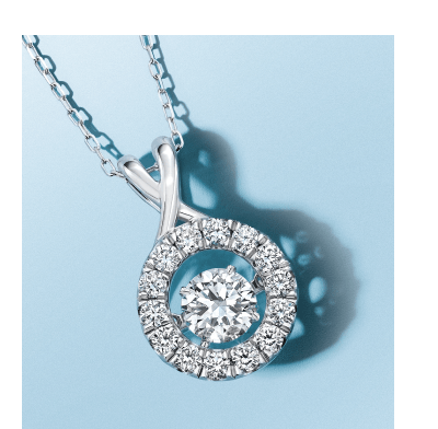 White gold pendant necklace with round center diamond and halo of smaller diamonds.