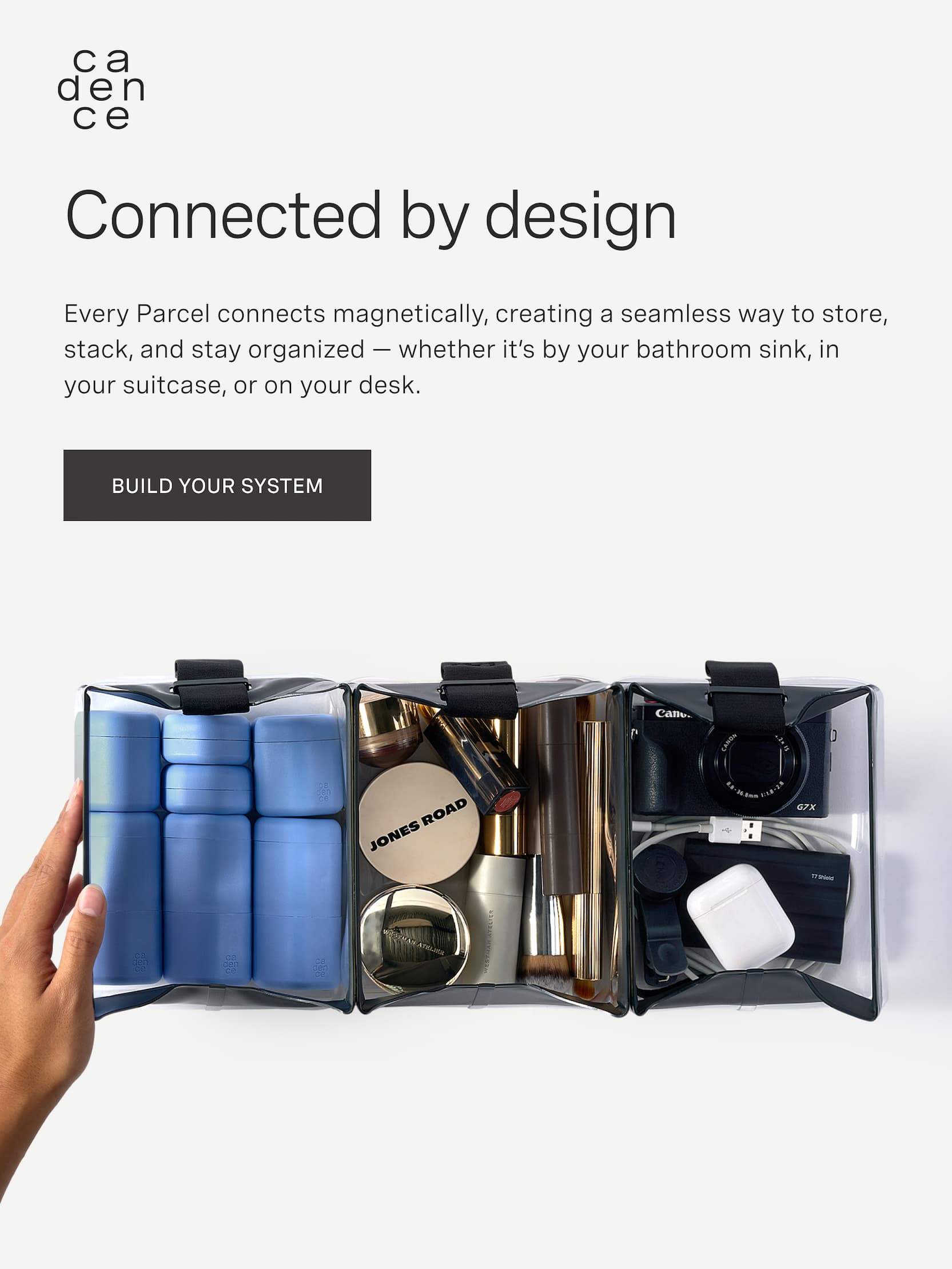 Click to build your Parcel system. Connected by design. Every Parcel connects magnetically, creating a seamless way to store, stack, and stay organized — whether it’s by your bathroom sink, in your suitcase, or on your desk. Image of The Parcel and The Capsules with other items packed. 