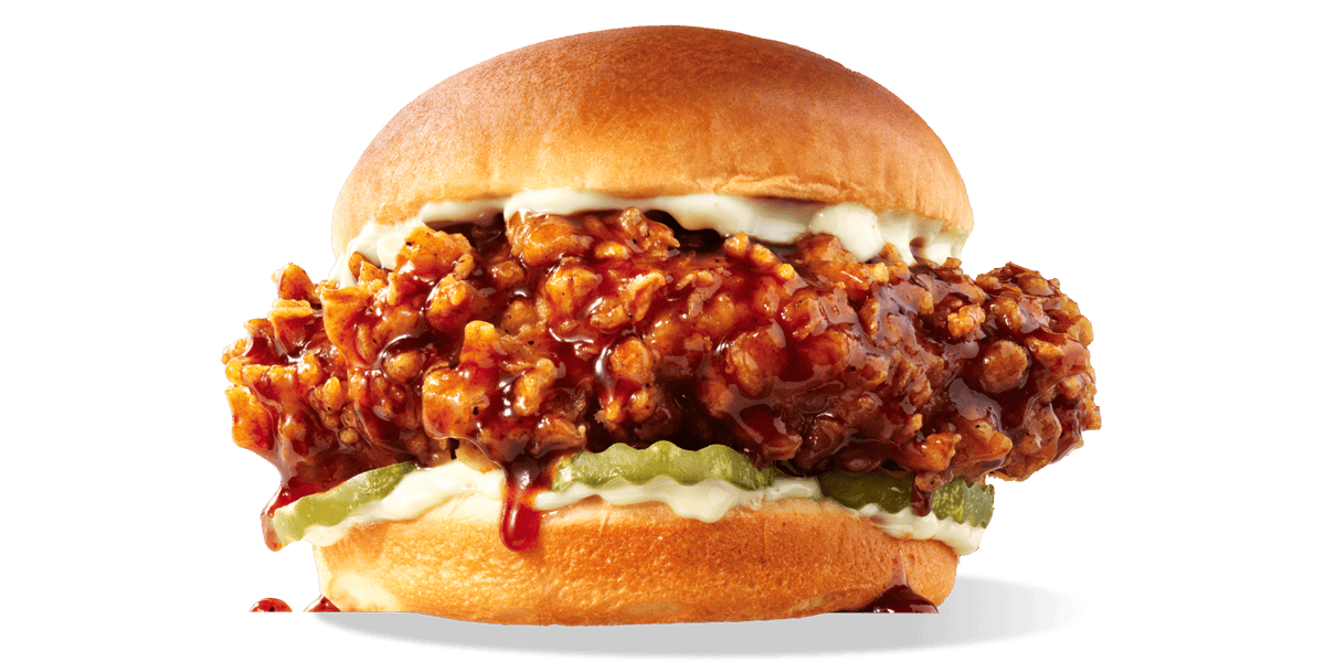 A KFC Chicken Sandwich dripping with Honey BBQ Sauce