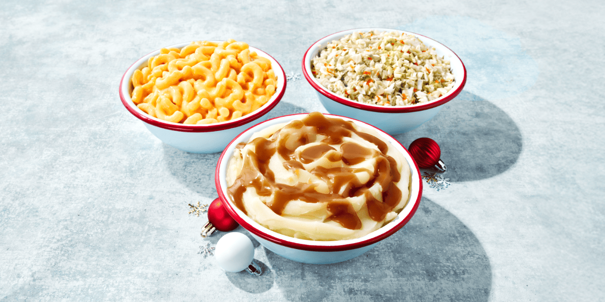 Three bowls of KFC Sides sitting on a beautiful snow covered surface.