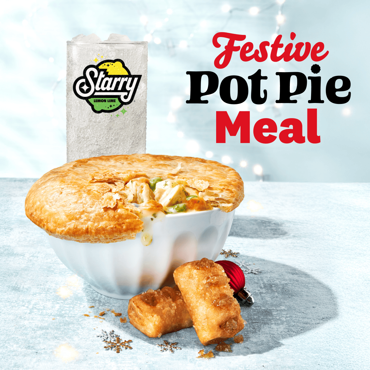 A delicious KFC pot pie with a drink and pie poppers.