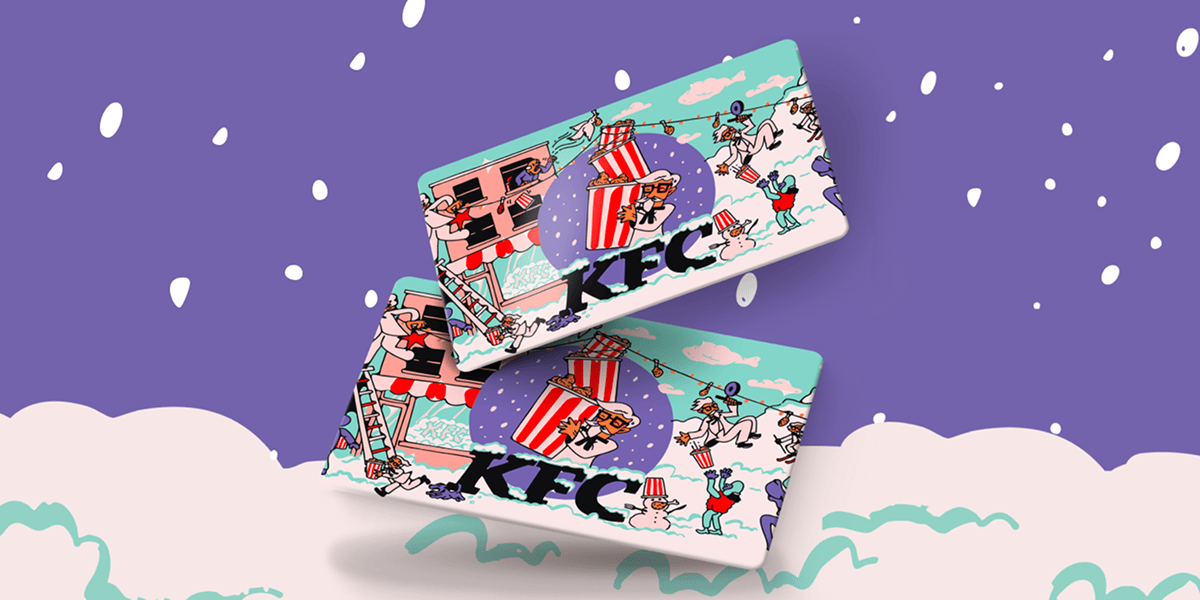 Two gift cards falling from the sky with the Colonel frolicing in a wintery scene on them.