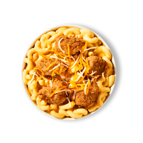 A Homestyle Mac & Cheese Bowl topped with crispy Chicken Nuggets and a 3-cheese blend.