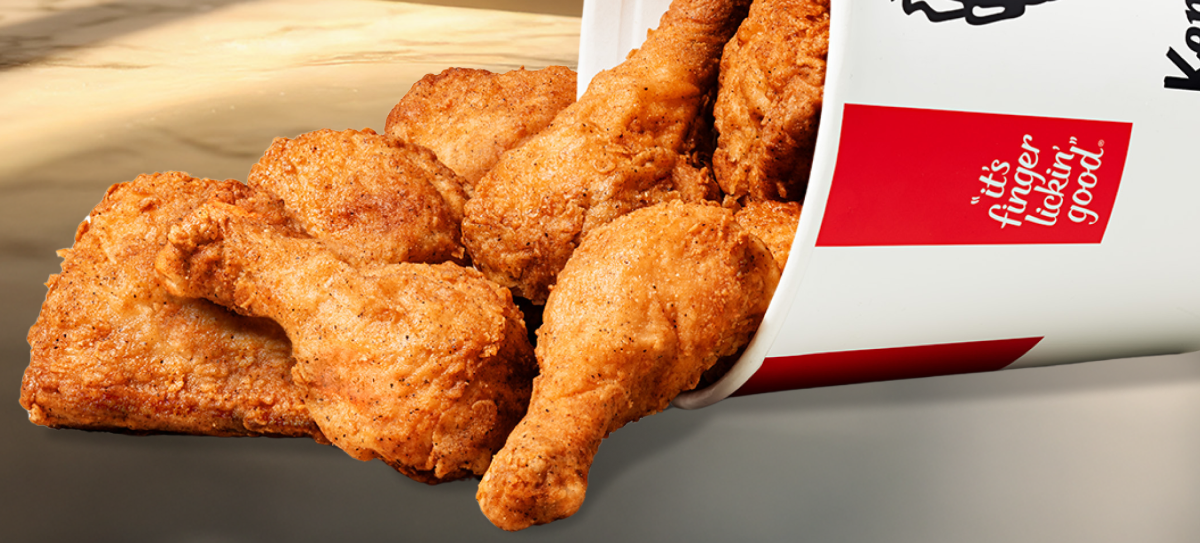 12 pieces of chicken spilling out of a KFC bucket.