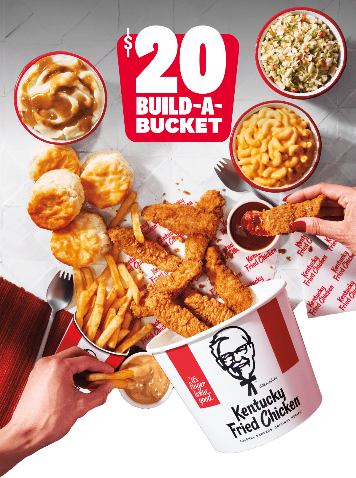 $20 Build-A-Bucket: People dipping Chicken into sauces while the rest of the Chicken spills over the table with several sides.