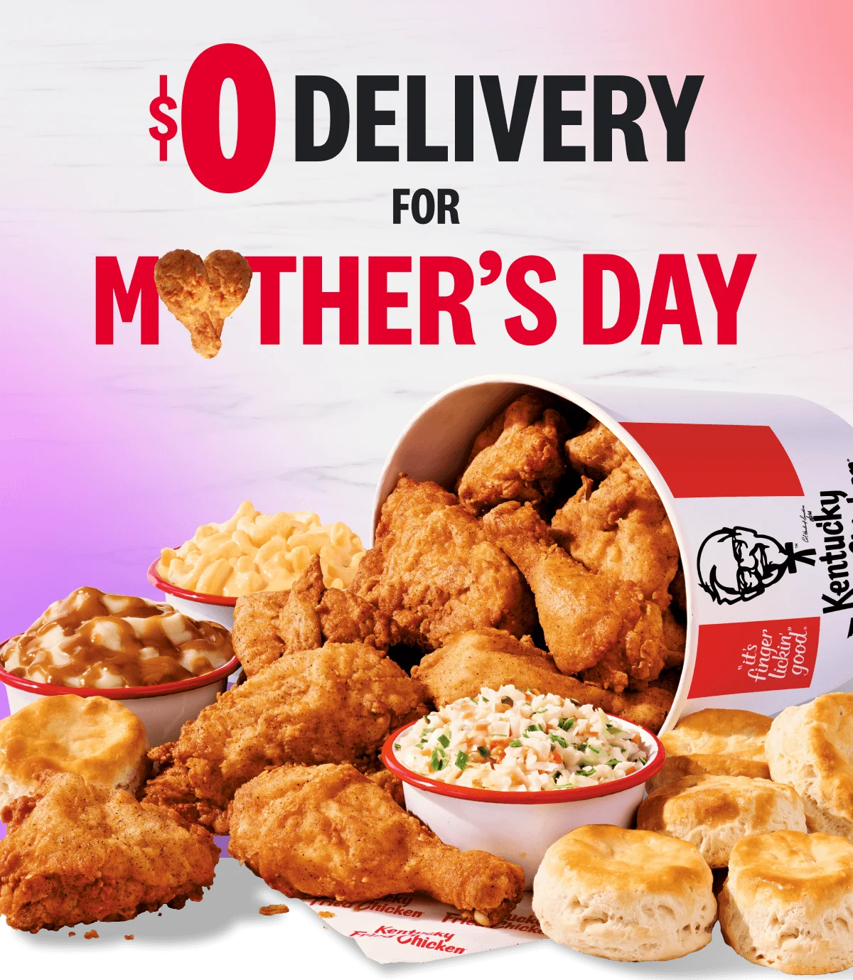A bucket of Chicken spilling out amidst a smorgasbord of sides