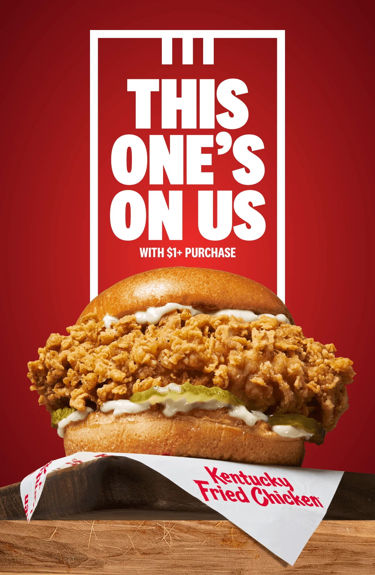 A cripsy Chicken Sandwich sitting on the edge of a table waiting for you to devour it.