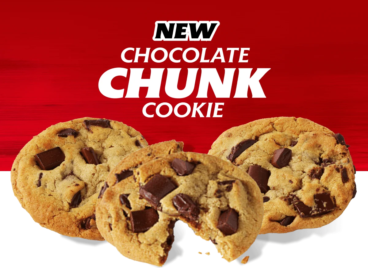 Three chocolate chip cookies, one with an awkward slice taken out