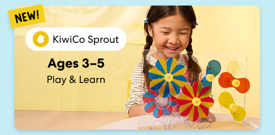 Young child smiling while working on creative KiwiCo Sprout projects, perfect for ages 3–5 for play and learn.