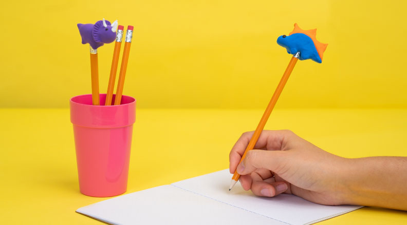 Decorate your pencils with fun dinosaur clay toppers.