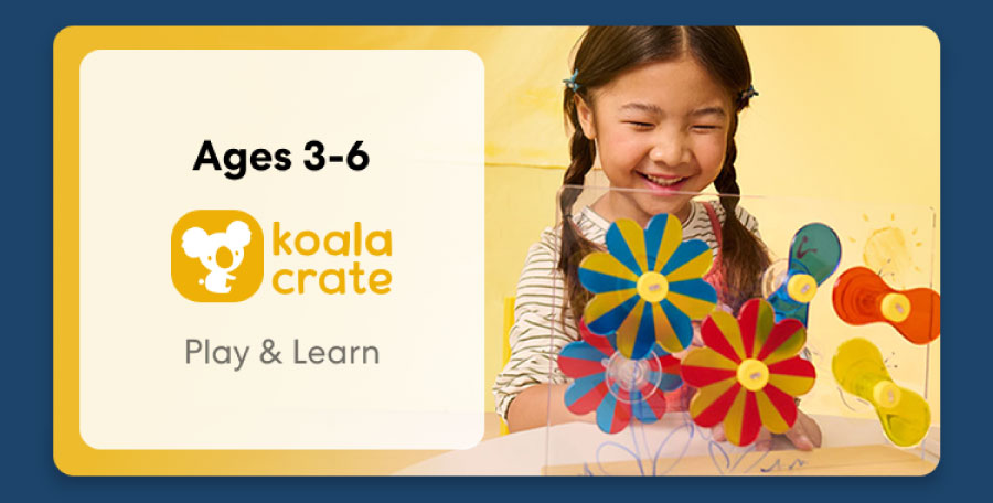 Young child smiling while working on creative KiwiCo Sprout projects, perfect for ages 3–5 for play and learn.