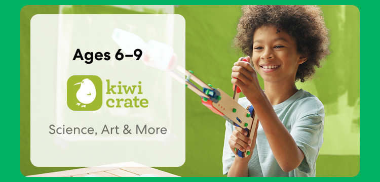 Young child smiling while working on a science experiment from KiwiCo Labs. Hands-on STEM learning for ages 6–9