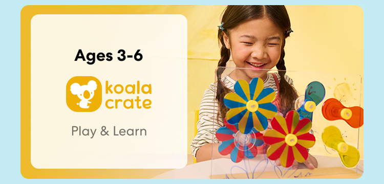 Young child smiling while working on creative Koala Crate project. Hands-on play and learning, perfect for ages 3 to 6
