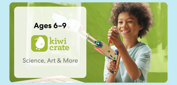 Young child smiling while working on a Kiwi Crate science experiment. Hands-on STEM learning for ages 6 to 9