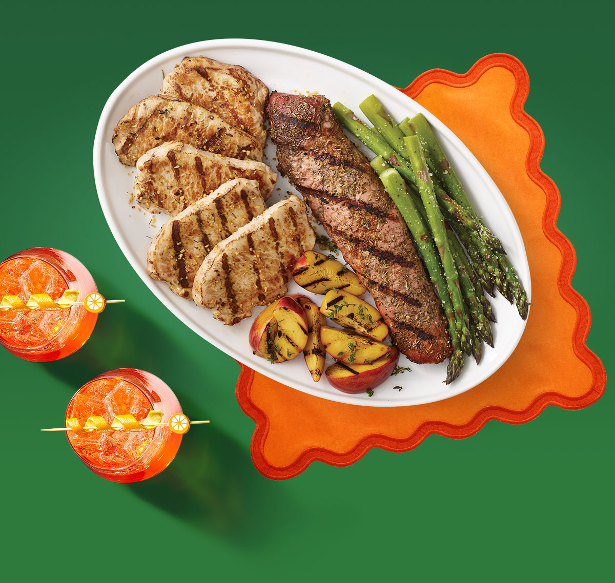 Grilled pork chops, tenderloin, asparagus and peaches, plus a fun summer drink.