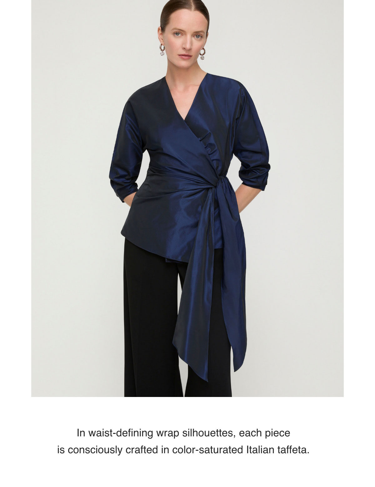 In waist-defining wrap silhouettes, each piece is consciously crafted in color-saturated Italian taffeta.
