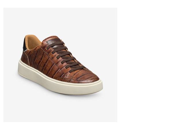 Click here to shop the bestselling Oliver Stretch-Lace Sneaker in chestnut embossed croc leather.