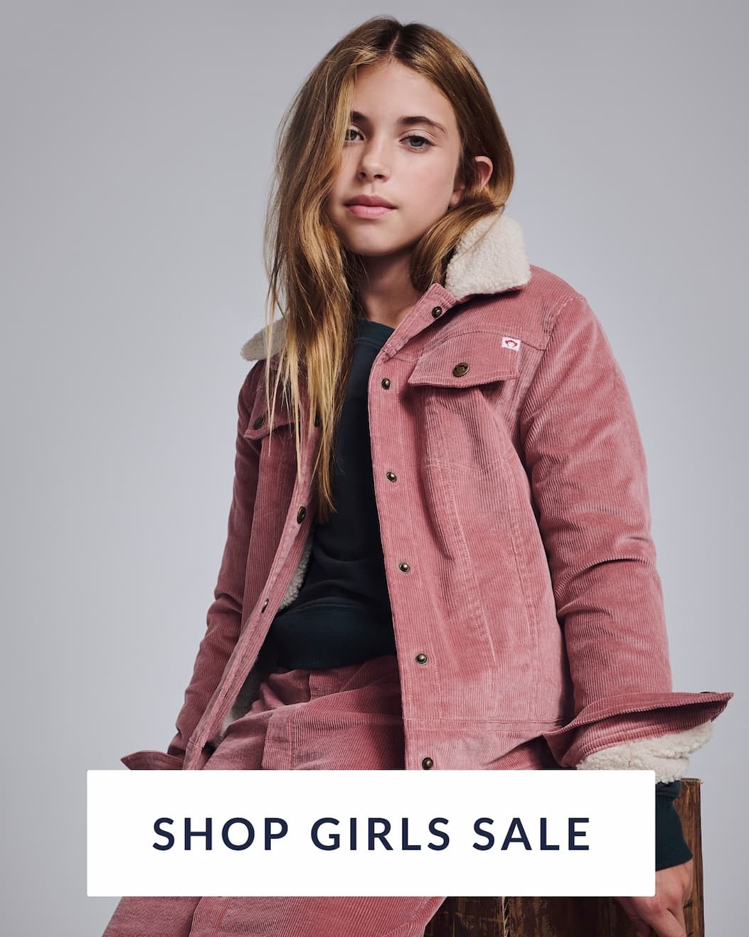 Girl in Pink Jacket with text shop girls sale
