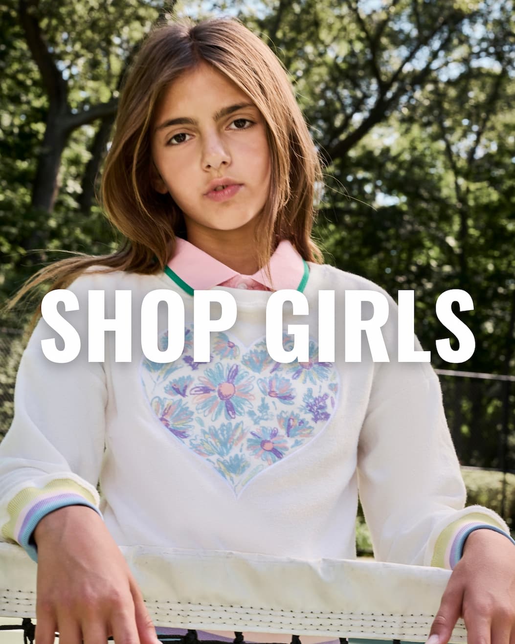 Girl in White Collared Shirt and Sweatshirt with White Text Shop Girls