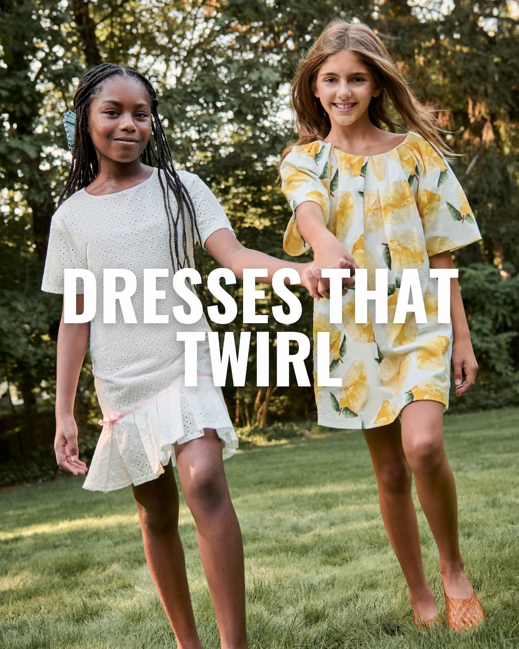 Two Girls in Summer Dresses Holding Hands Walking