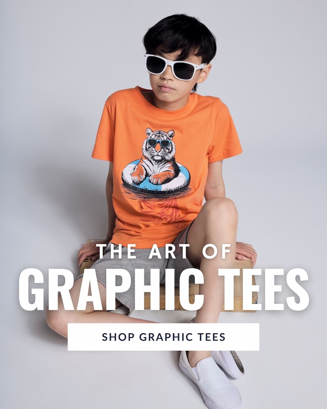 an image of a boy in a orange graphic tee with a tiger in a pool float