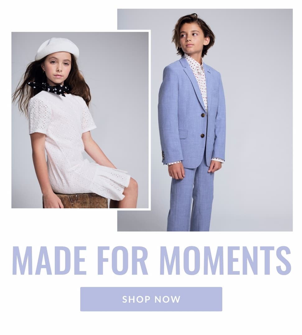 Girl and boy on grey background wearing white dress and light blue suit