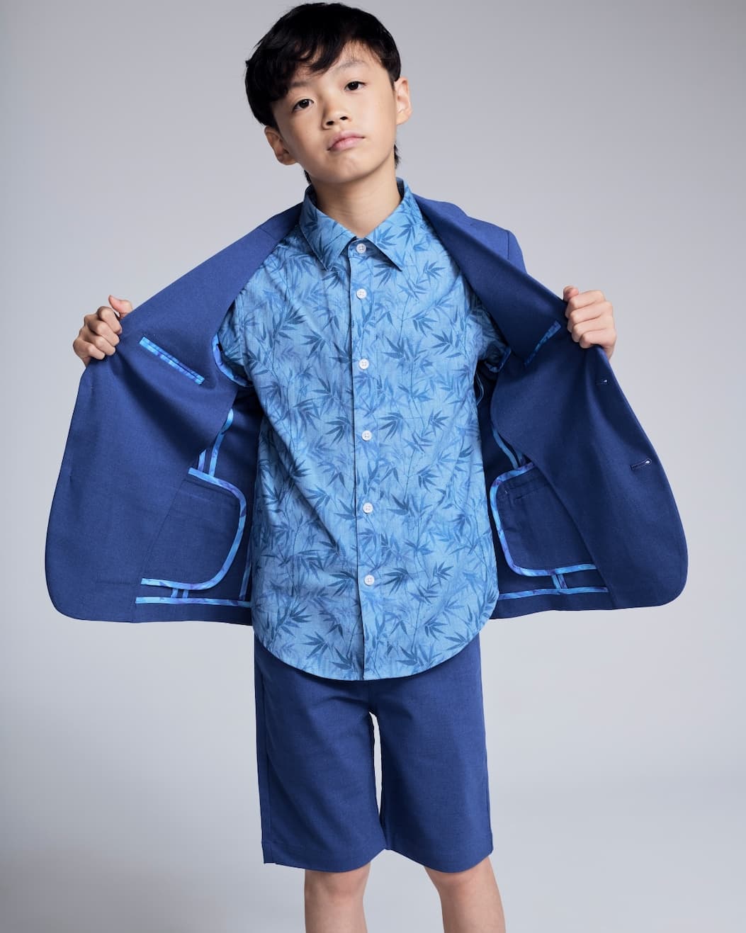 Boy on grey background wearing Linen Blue Suit Set
