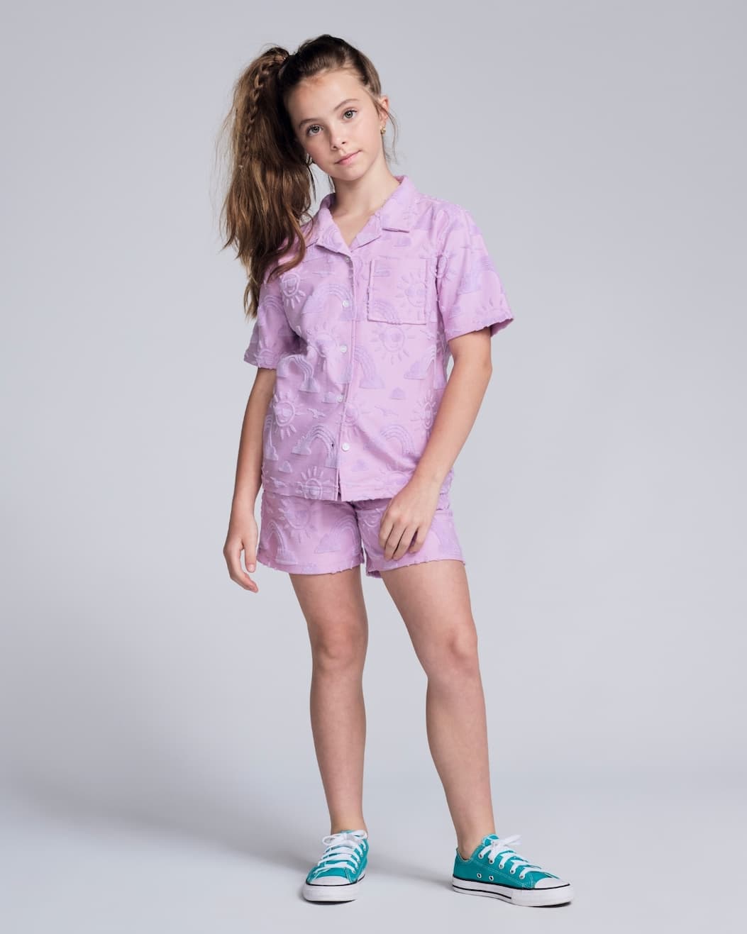 girl on grey background wearing lilac terry set