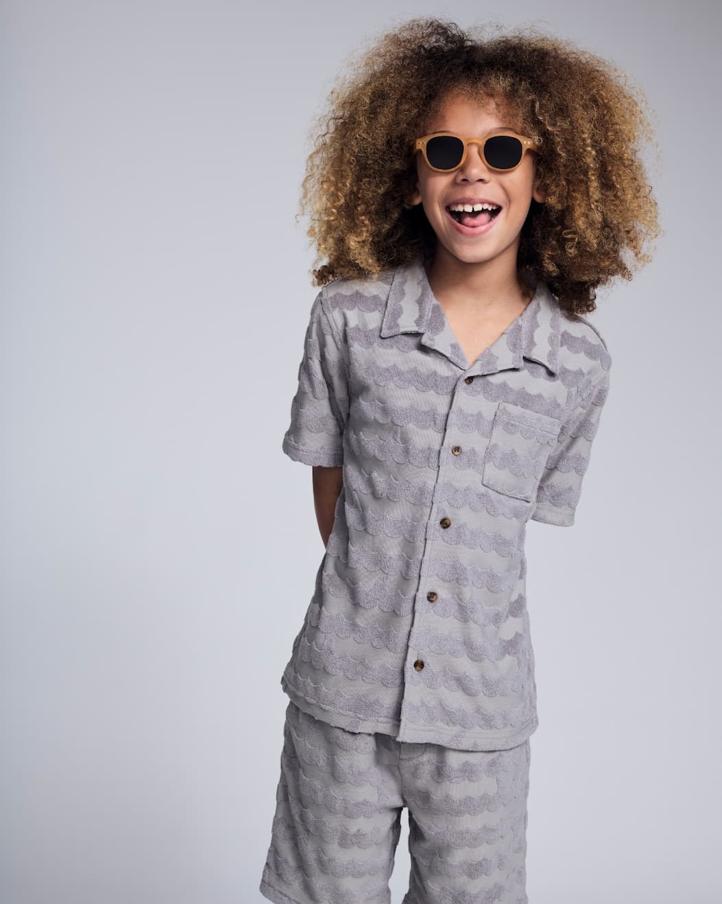 Boy on grey background wearing grey terry set